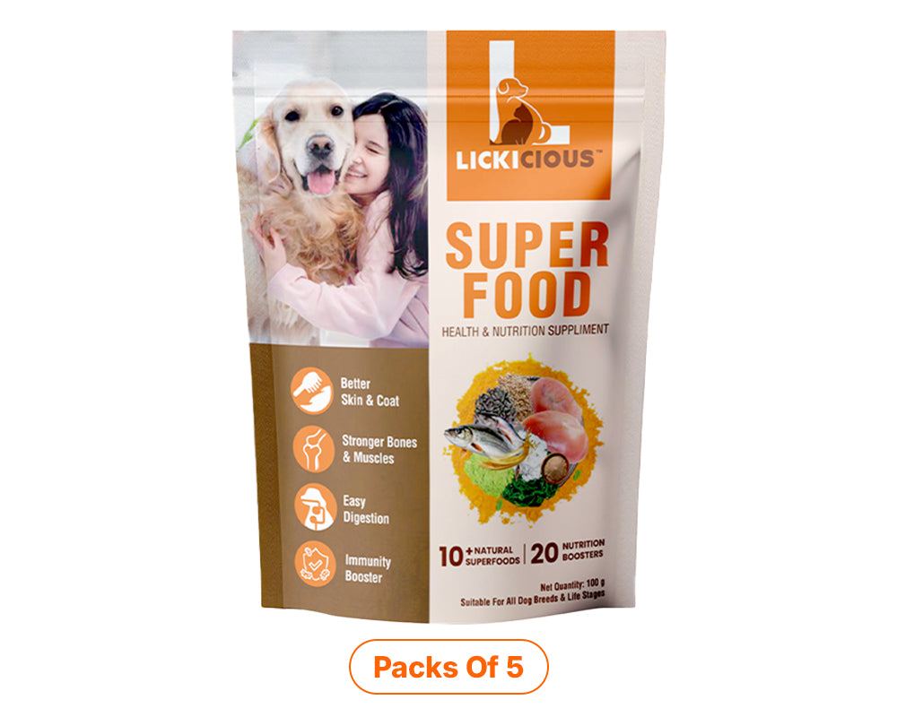 A stand-up pouch of Lickcious Super Food health and nutrition supplement for dogs, featuring a white and orange design with a photo of a woman and dog on the front and a 'Pack of 5' label below.
